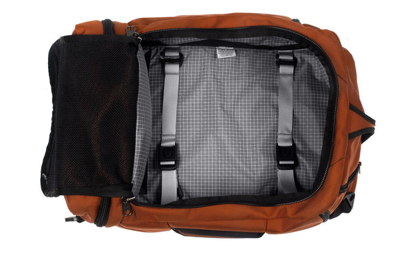 An open Techonaut 30 with a Burnt Orange exterior and a Northwest Sky (grey) interior.